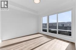 Bright interior space featuring a large three-panel sliding glass door with white frames -