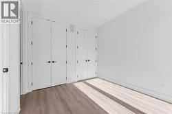 Crisp white walls paired with wood-finish flooring -
