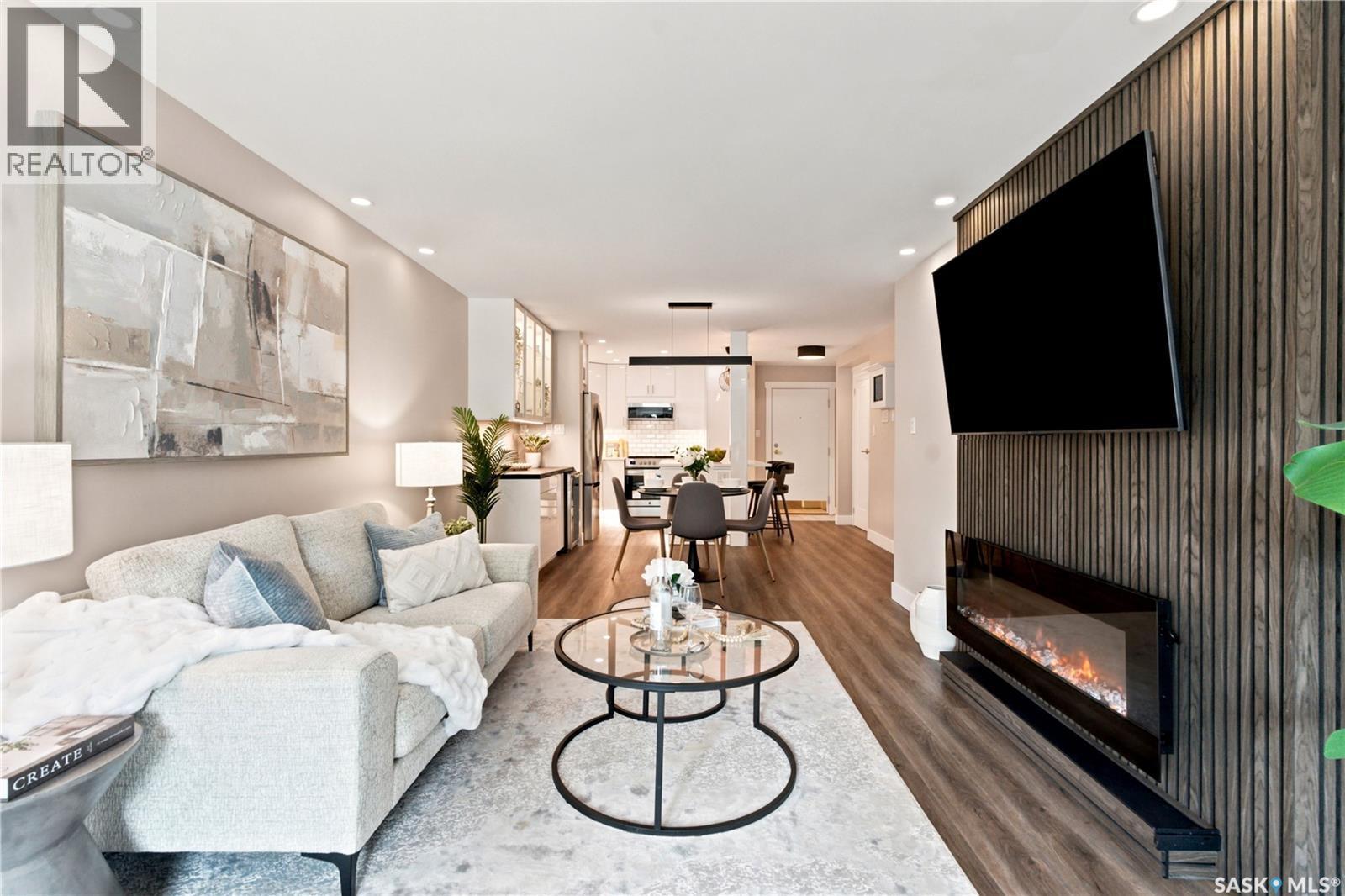 105 410 Main Street, Saskatoon, SK - Indoor Photo Showing Living Room With Fireplace