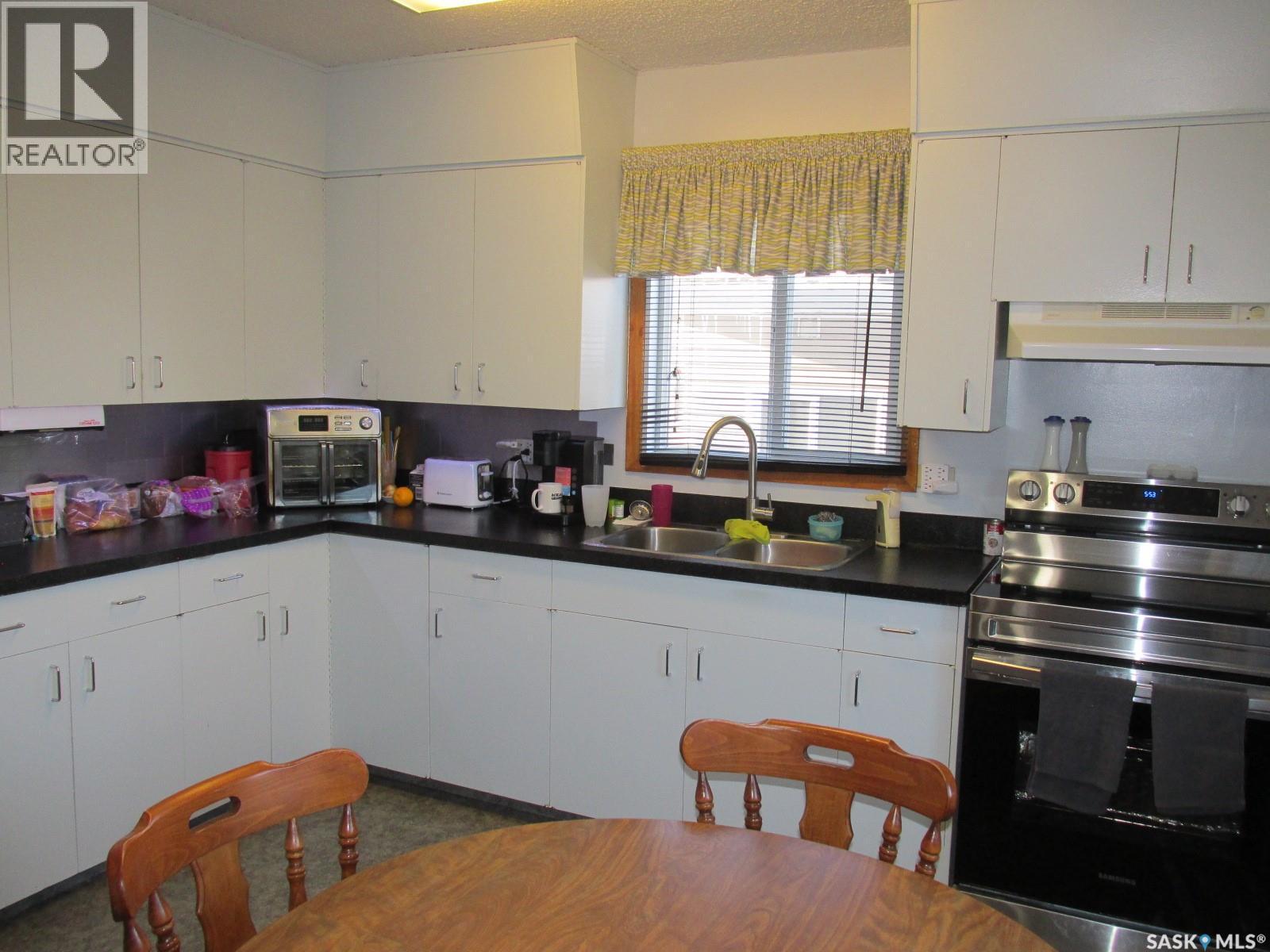 1103 3Rd Street W, Nipawin, SK - Indoor Photo Showing Kitchen With Double Sink