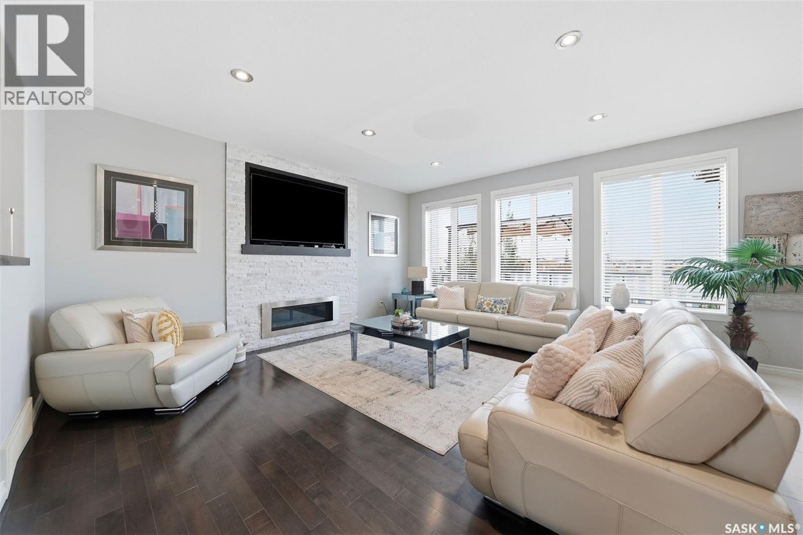 107 Schumacher Bay, Saskatoon, SK - Indoor Photo Showing Living Room With Fireplace