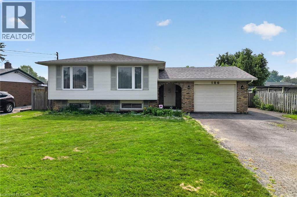 Split-level residence featuring white siding and brick accents - 186 Glenmor Drive, Caledonia, ON - Outdoor