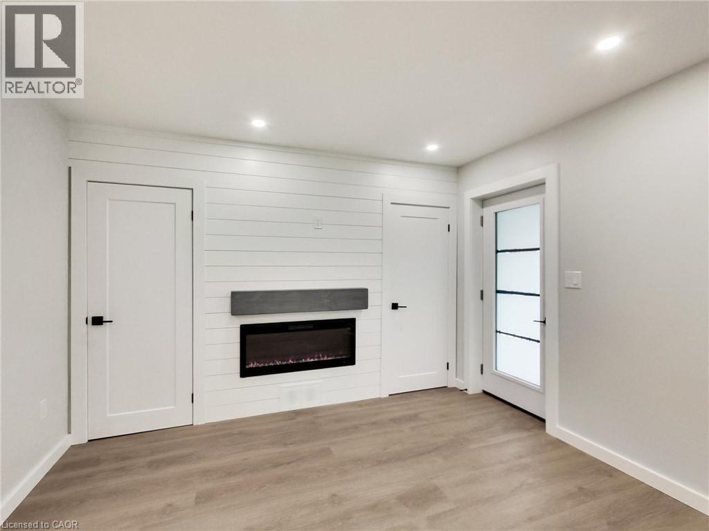 67 Cope Street, Hamilton, ON - Indoor Photo Showing Other Room With Fireplace