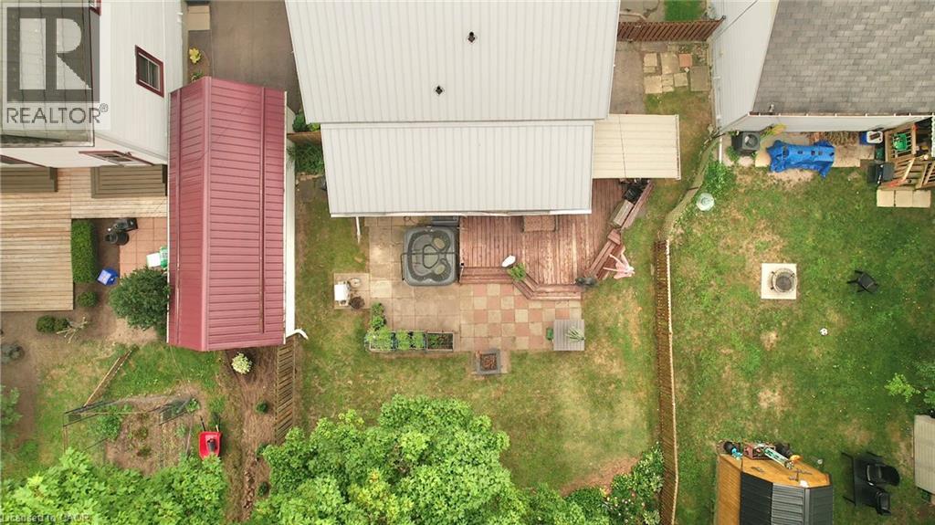 Expansive outdoor living area featuring a multi-level wooden deck, - 88 Brook Street, Simcoe, ON -