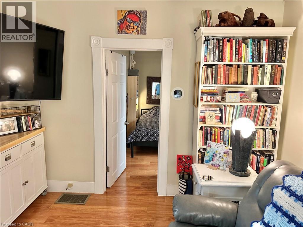 Warm-toned wood-finish flooring complements the light wall color - 88 Brook Street, Simcoe, ON - Indoor