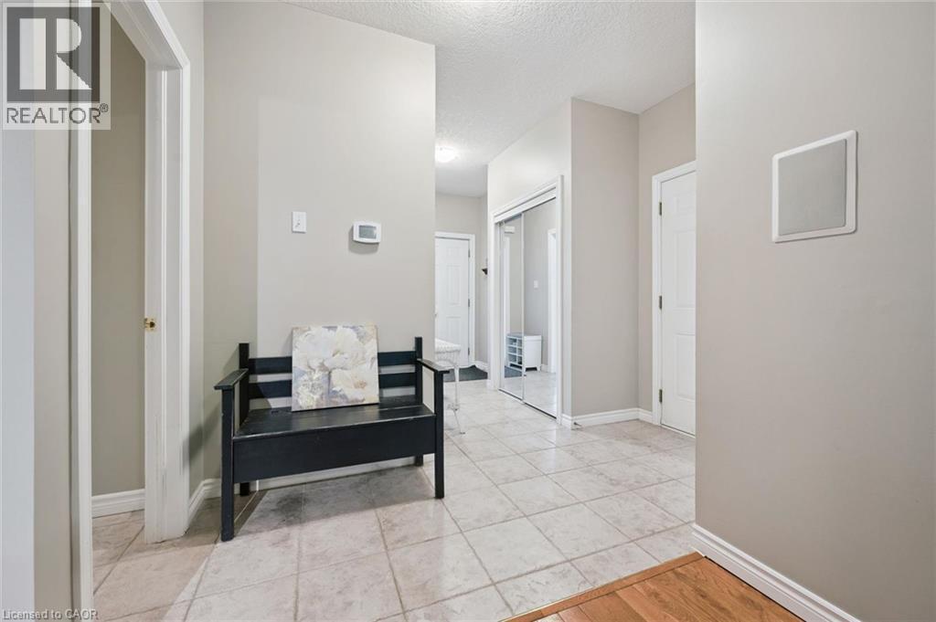 Tile flooring throughout the entryway - 23 Knack Lane, Cambridge, ON - Indoor Photo Showing Other Room