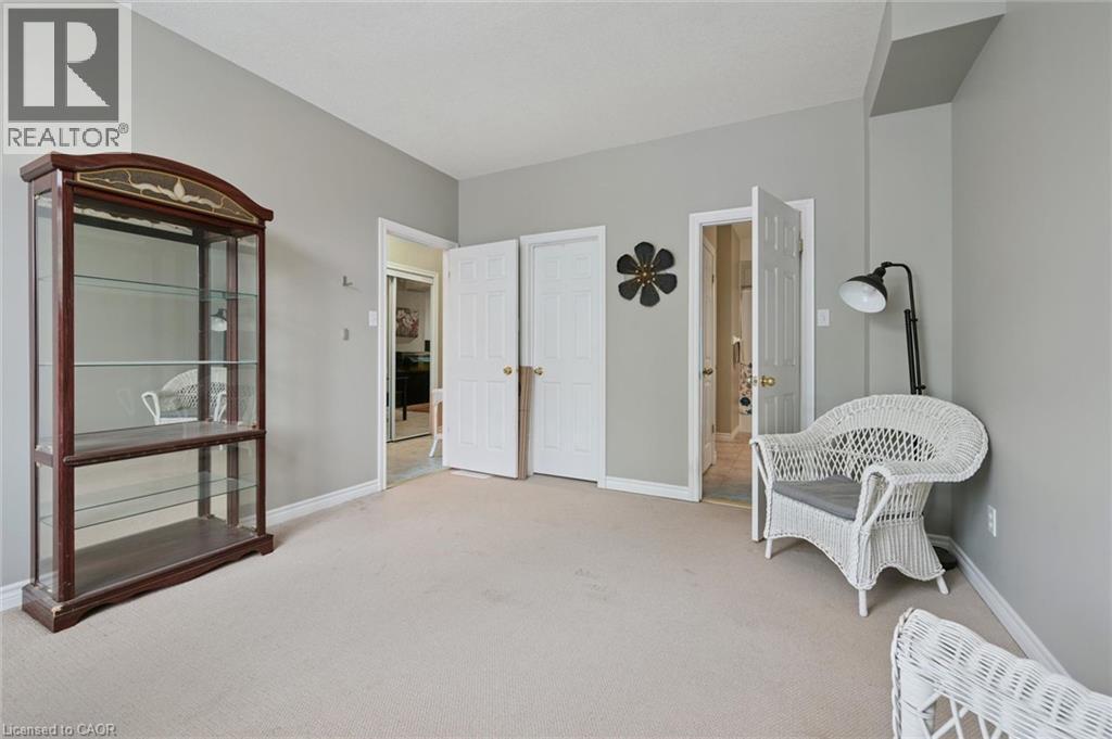 Light gray wall paint complemented by white trim and a neutral carpet - 23 Knack Lane, Cambridge, ON - Indoor