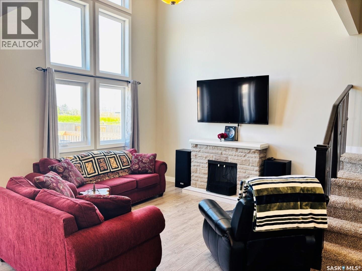 255 Eaton Crescent, Saskatoon, SK - Indoor Photo Showing Living Room With Fireplace
