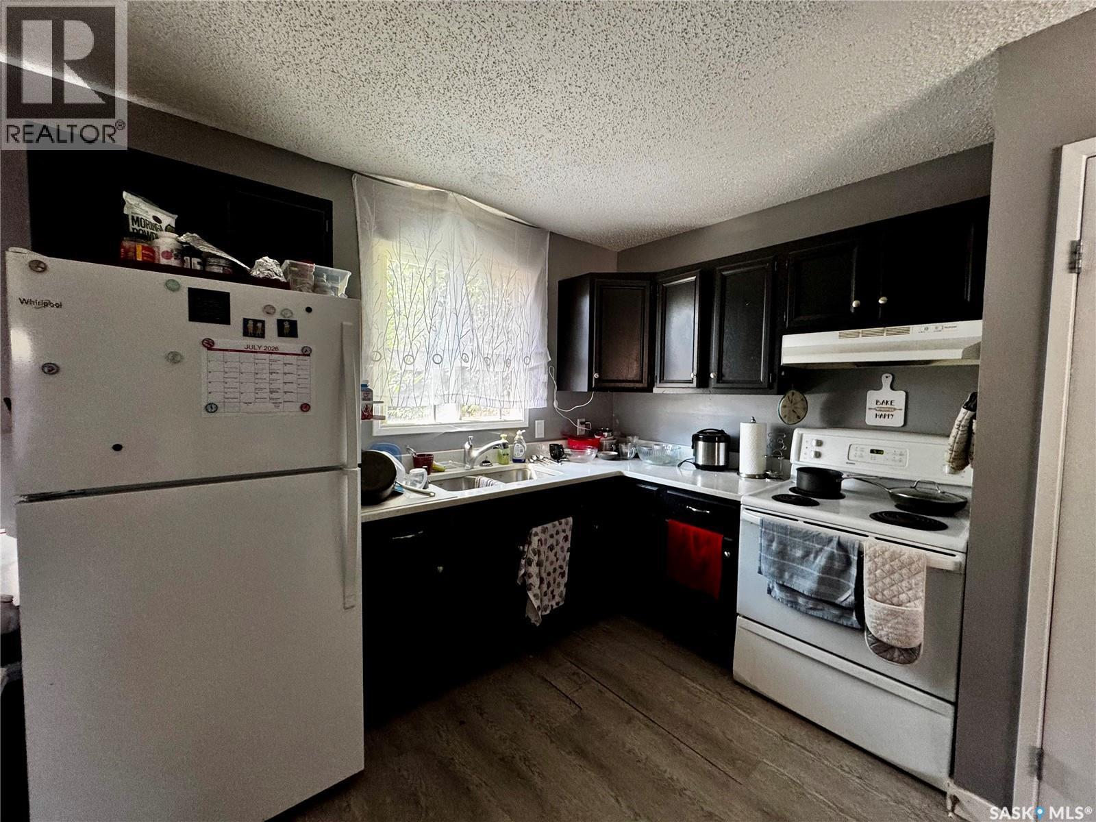 3554 Fairlight Drive, Saskatoon, SK - Indoor Photo Showing Kitchen With Double Sink