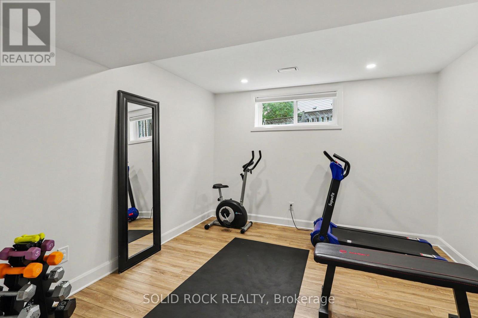 Basement Bedroom #5 with egress window - 939 Como Crescent, Ottawa, ON - Indoor Photo Showing Gym Room