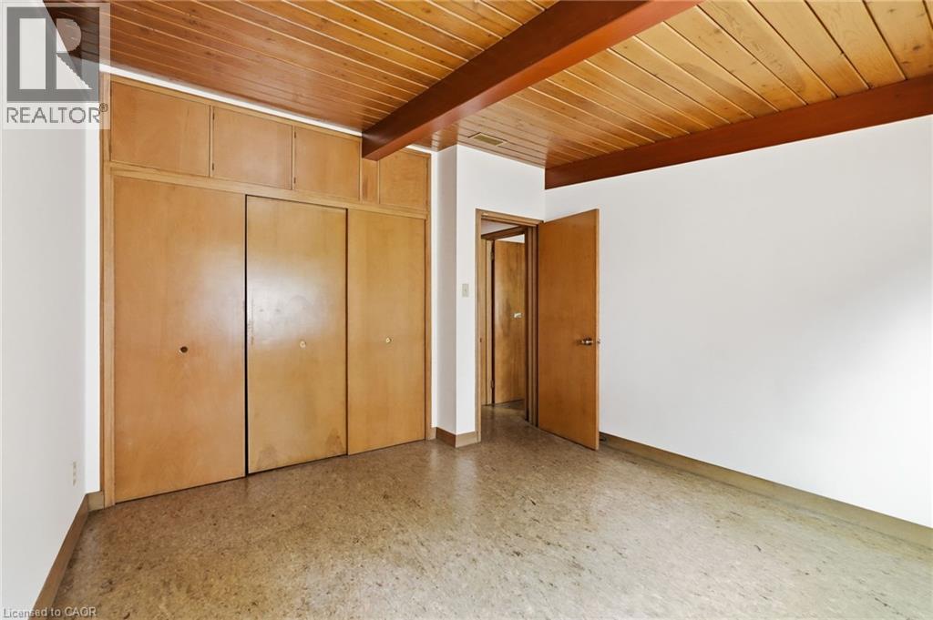Room featuring a wood-panel ceiling with exposed beams, light wood-finish built-in cabinetry, and neutral-toned flooring - 264 Mountain Brow Boulevard, Hamilton, ON - Indoor Photo Showing Other Room