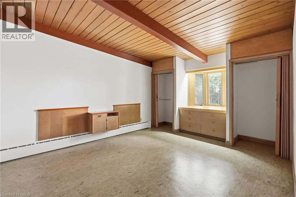 Room featuring a wood-panel ceiling with exposed beams, built-in cabinetry, and a window with a sill - 264 Mountain Brow Boulevard, Hamilton, ON - Indoor Photo Showing Other Room