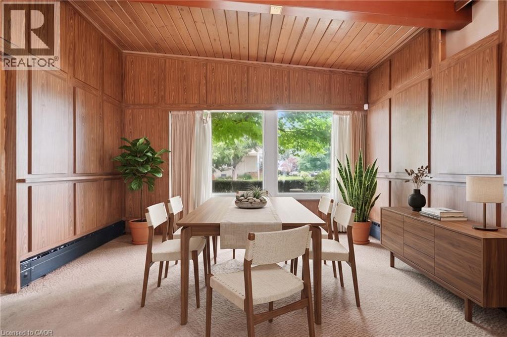 Virtually Staged -Room featuring extensive wood paneling, a wood plank ceiling, and a large picture window - 264 Mountain Brow Boulevard, Hamilton, ON - Indoor Photo Showing Dining Room