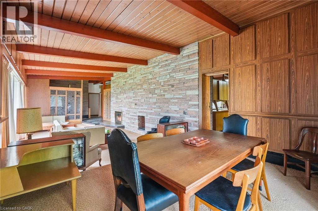Expansive dining area featuring a wood-panel accent wall and wood-finish ceiling - 264 Mountain Brow Boulevard, Hamilton, ON - Photo Showing Dining Room