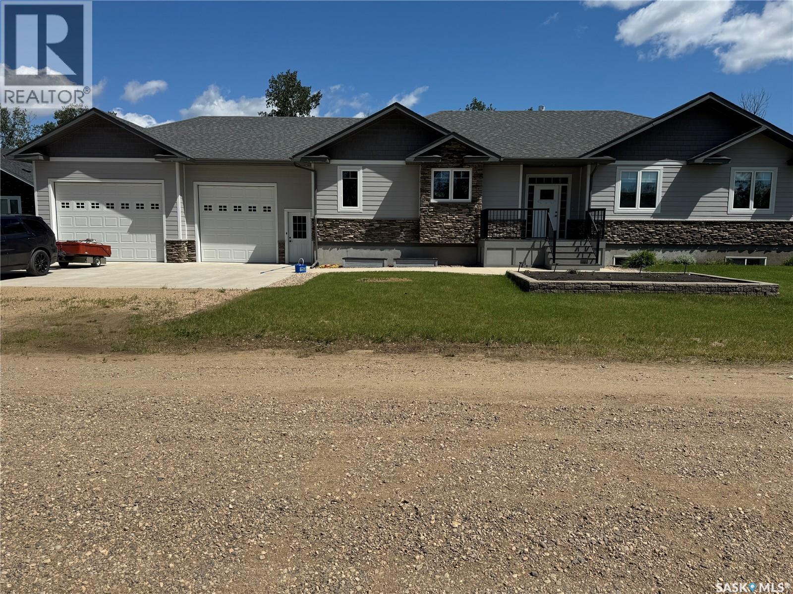 214 Hillside Drive, Tobin Lake, SK - Outdoor With Deck Patio Veranda With Facade