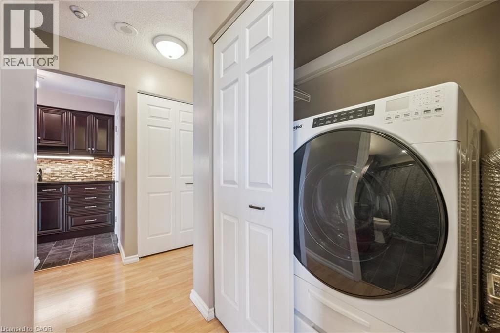 One piece washer/dryer unit - 1414 E King Street E Unit# 808, Kitchener, ON - Indoor Photo Showing Laundry Room