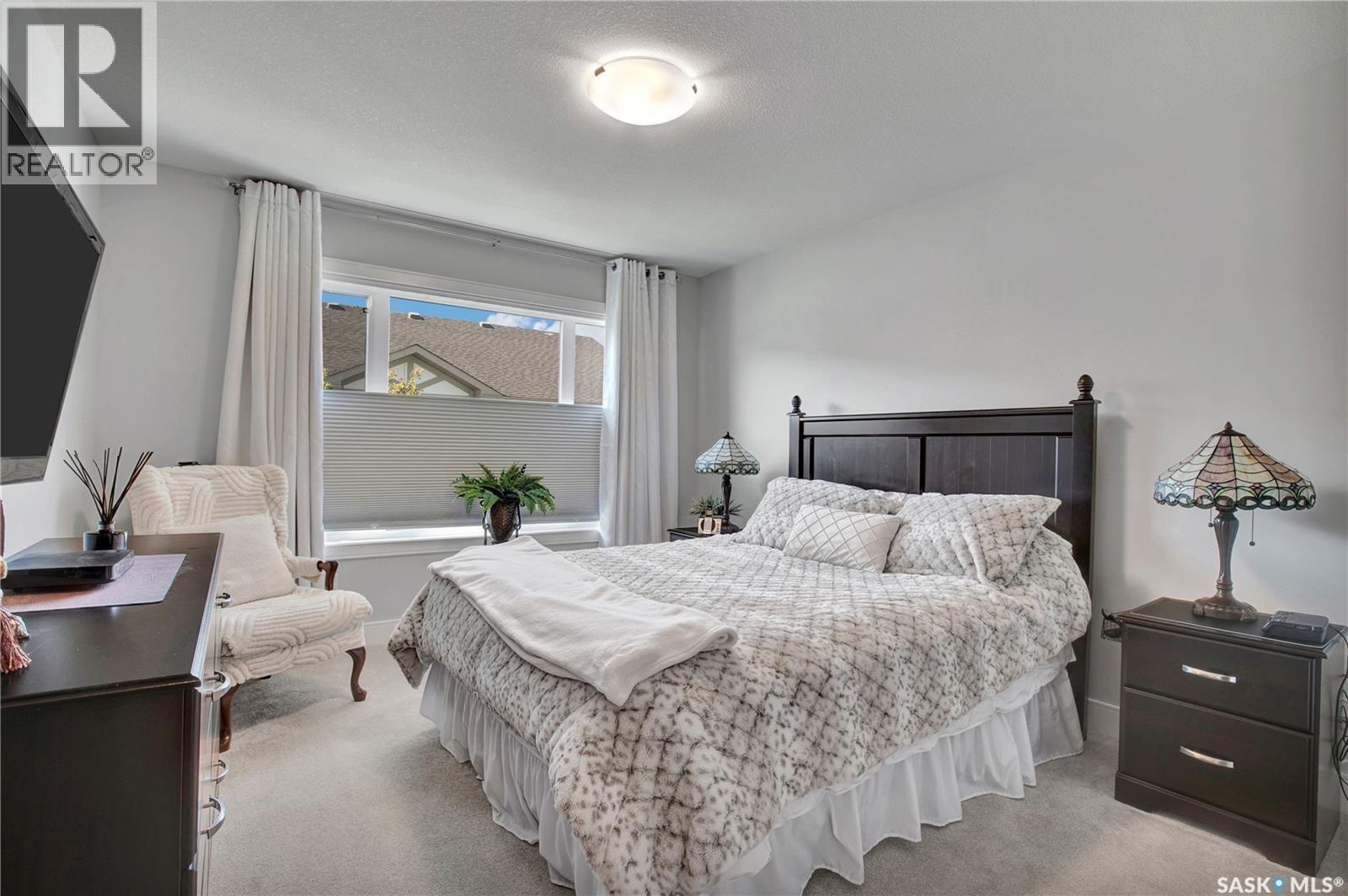 4 437 Palmer Crescent, Warman, SK - Indoor Photo Showing Bedroom