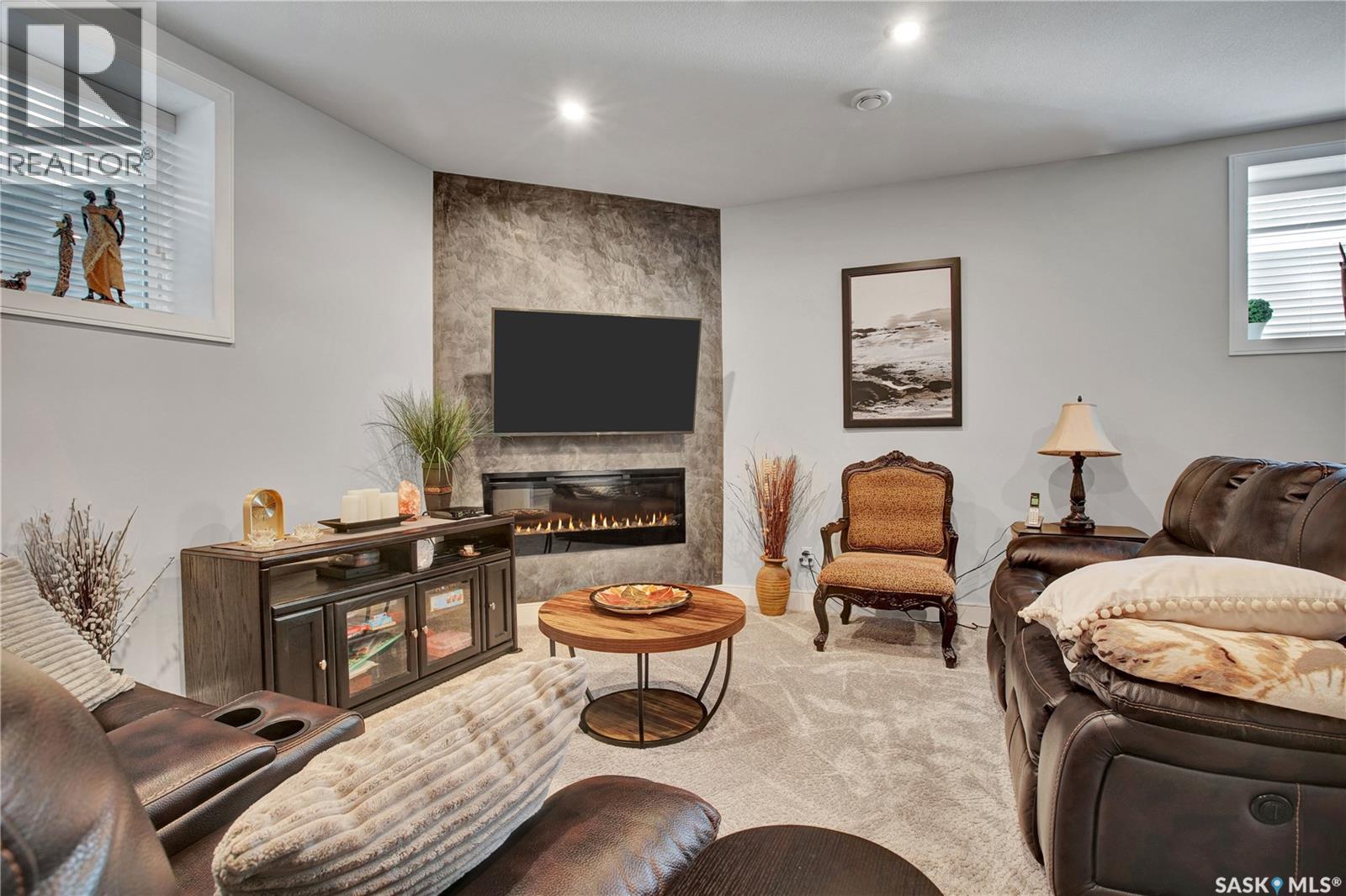 4 437 Palmer Crescent, Warman, SK - Indoor With Fireplace