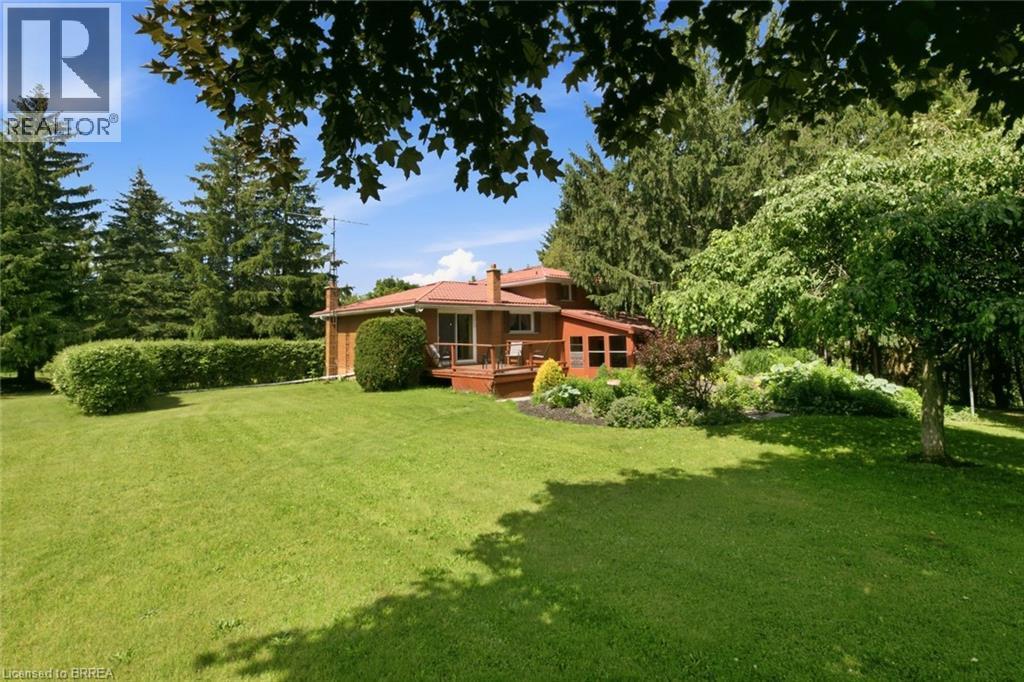 Expansive green lawn with mature trees and established perimeter hedging - 1598 Highway No 6, Hamilton, ON - Outdoor