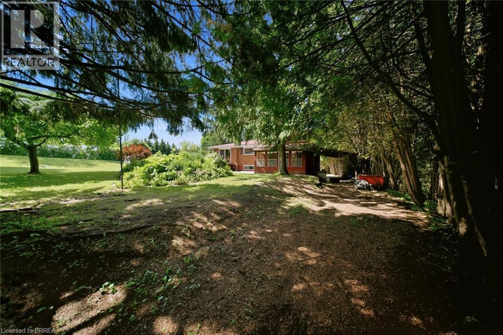 Expansive property featuring mature trees and a manicured lawn - 1598 Highway No 6, Hamilton, ON - Outdoor