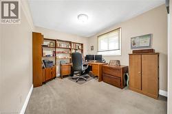 Neutral-toned walls complement the carpeted flooring - 