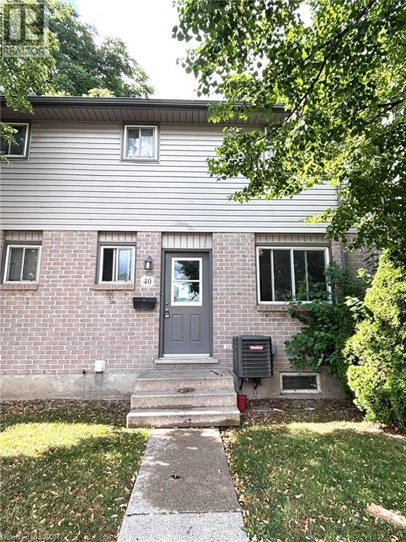 Two-story residence featuring a brick first level and horizontal siding on the second level - 490 Third Street Unit# 40, London, ON - Outdoor