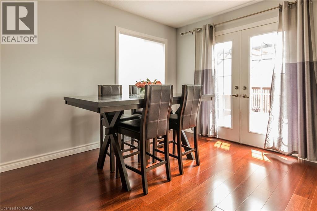 Dining area featuring rich wood-finish flooring - 44 Lemon Grass Street, Kitchener, ON - Indoor Photo Showing Dining Room
