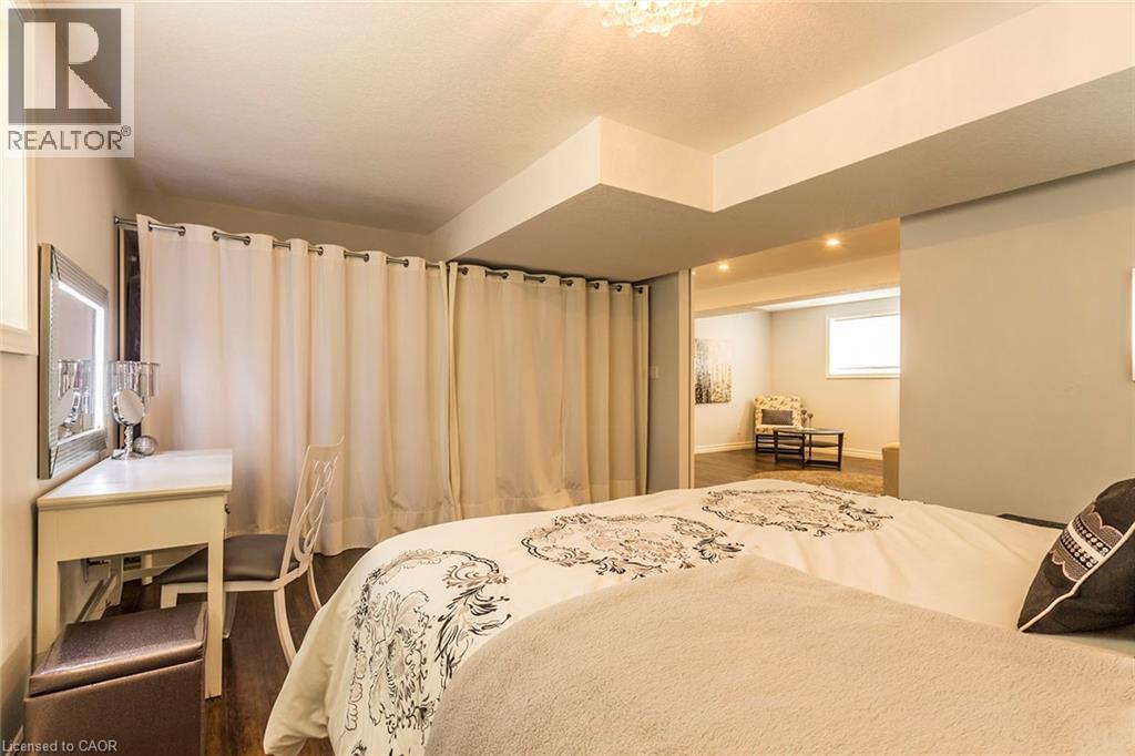 Bedroom with wood-finish flooring, recessed lighting, and a neutral color palette - 44 Lemon Grass Street, Kitchener, ON - Indoor Photo Showing Bedroom