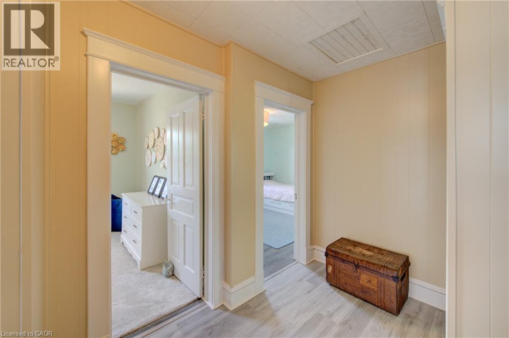 Hallway with wood-finish flooring and light-toned wall paneling - 39 Kerr Street, Cambridge, ON - Indoor Photo Showing Other Room