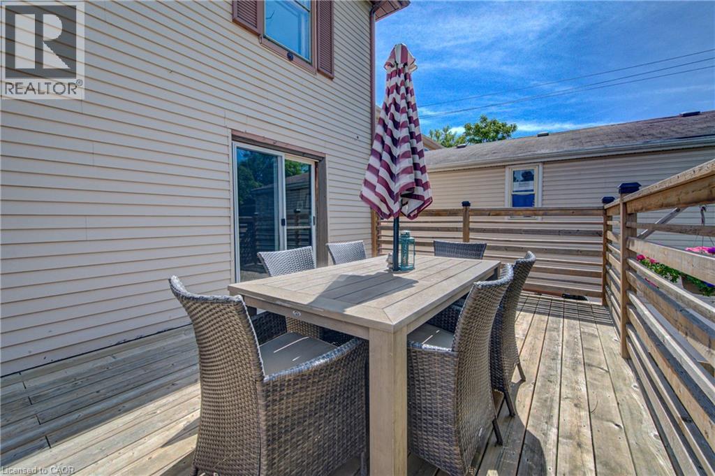 Wood-finish deck with a sliding glass door entry - 39 Kerr Street, Cambridge, ON - Outdoor With Deck Patio Veranda With Exterior