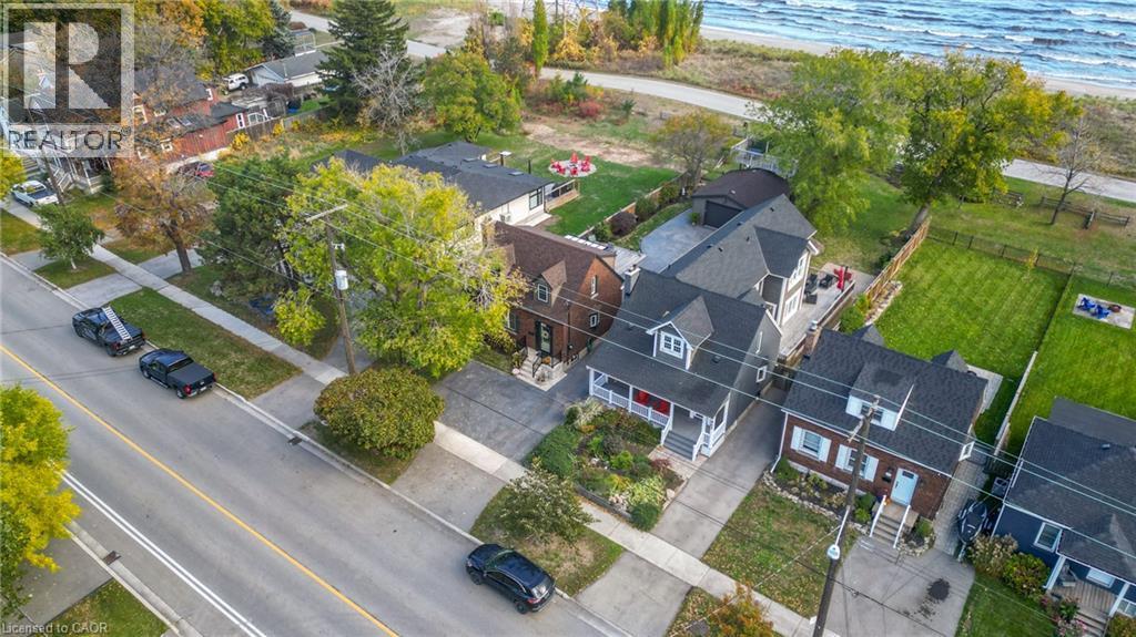 Aerial perspective showcasing a residential property with a dark shingle roof and light-toned siding - 851 Beach Boulevard, Hamilton, ON - Outdoor With View