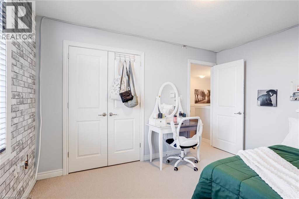 Neutral wall paint complementing soft carpet flooring - 7 Kinsman Drive, Binbrook, ON - Indoor Photo Showing Bedroom