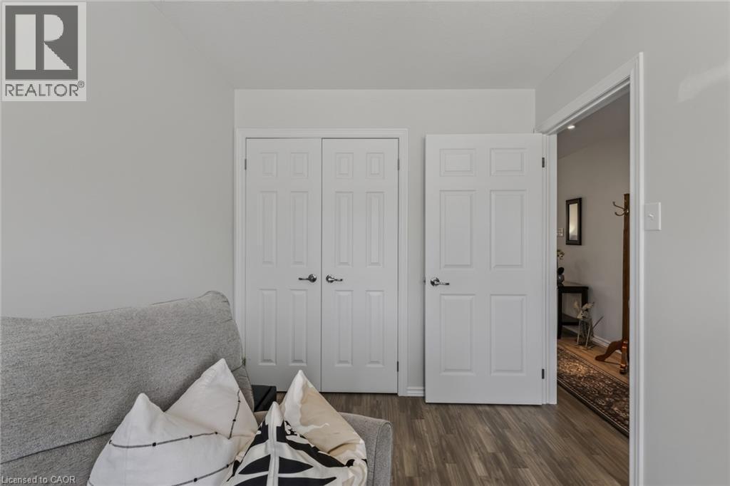 Light gray walls paired with wood-finish flooring - 51 Millcroft Drive, Simcoe, ON - Indoor