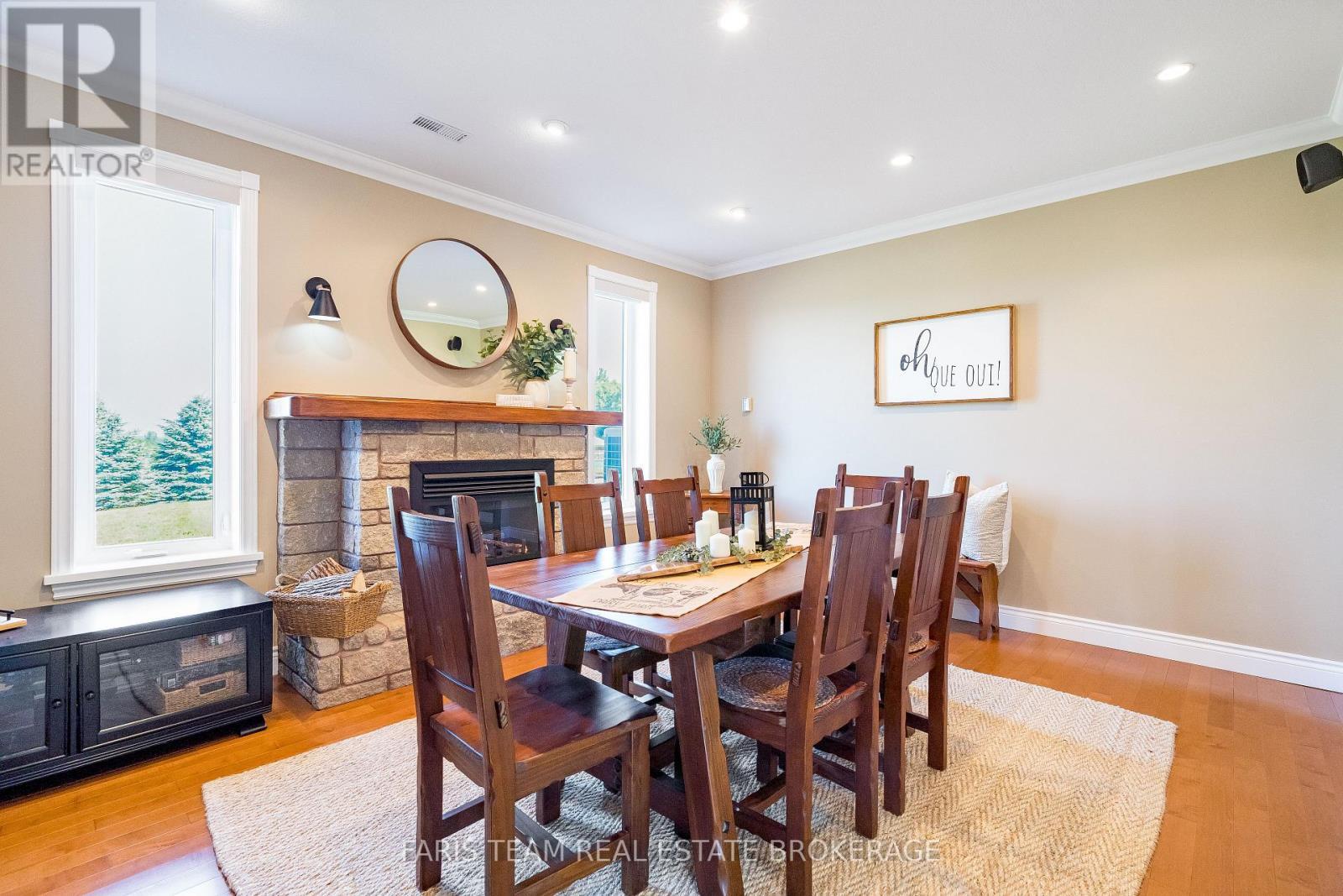 130 Concession 15 W, Tiny, ON - Indoor Photo Showing Dining Room With Fireplace