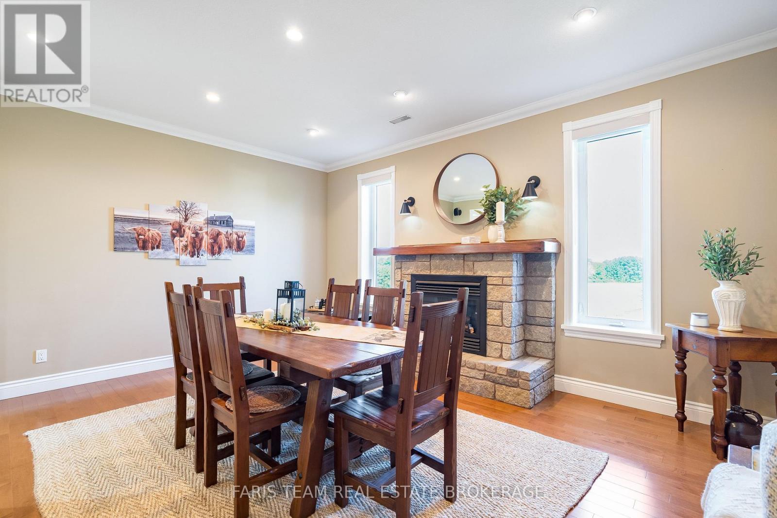 130 Concession 15 W, Tiny, ON - Indoor Photo Showing Dining Room With Fireplace