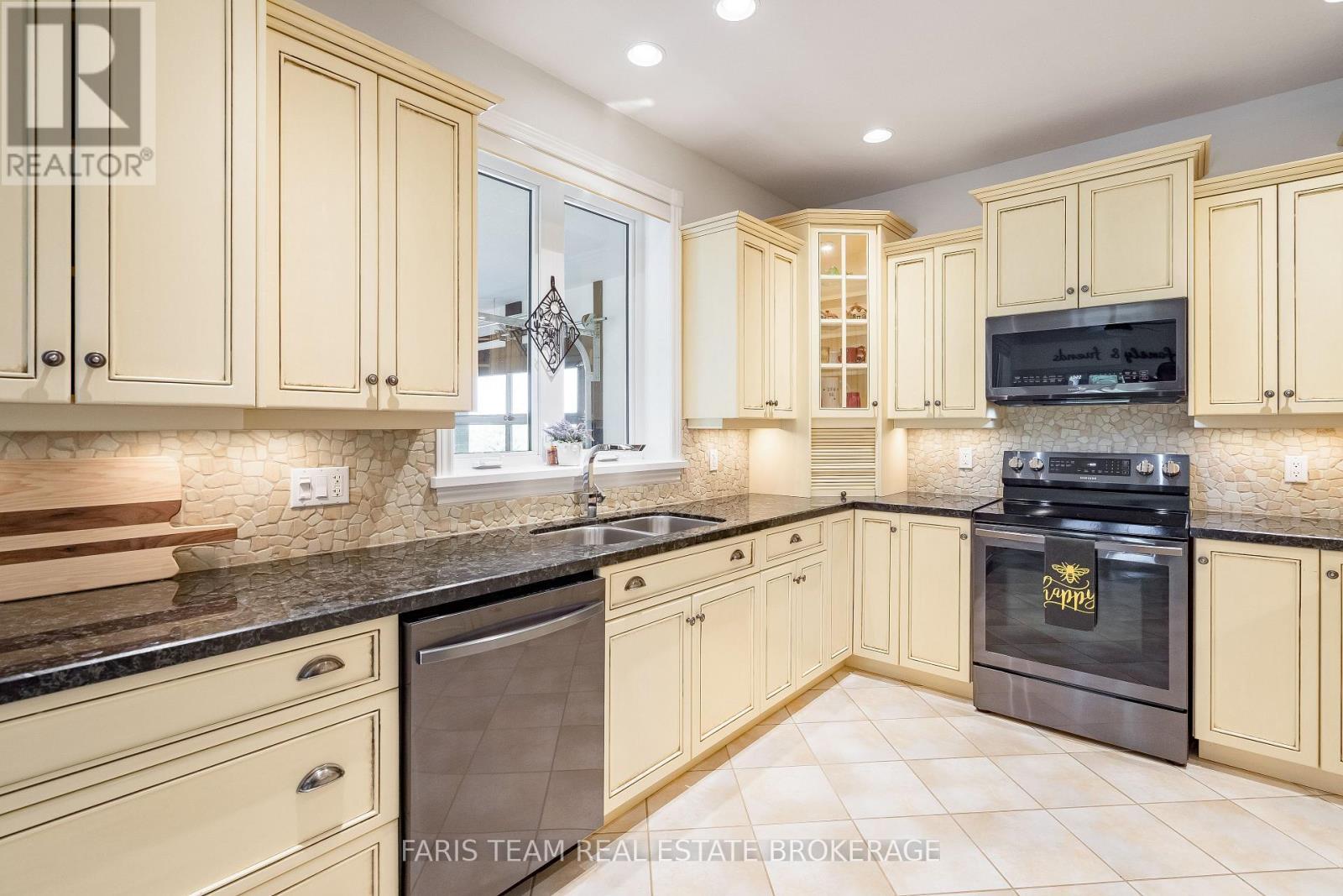 130 Concession 15 W, Tiny, ON - Indoor Photo Showing Kitchen With Double Sink