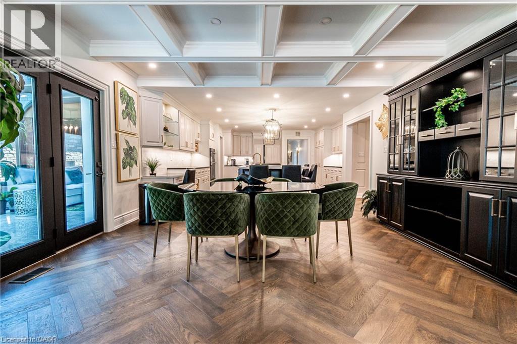 Expansive dining area featuring coffered ceilings and herringbone wood-finish flooring - 76 Adriatic Boulevard, Hamilton, ON - Indoor Photo Showing Other Room