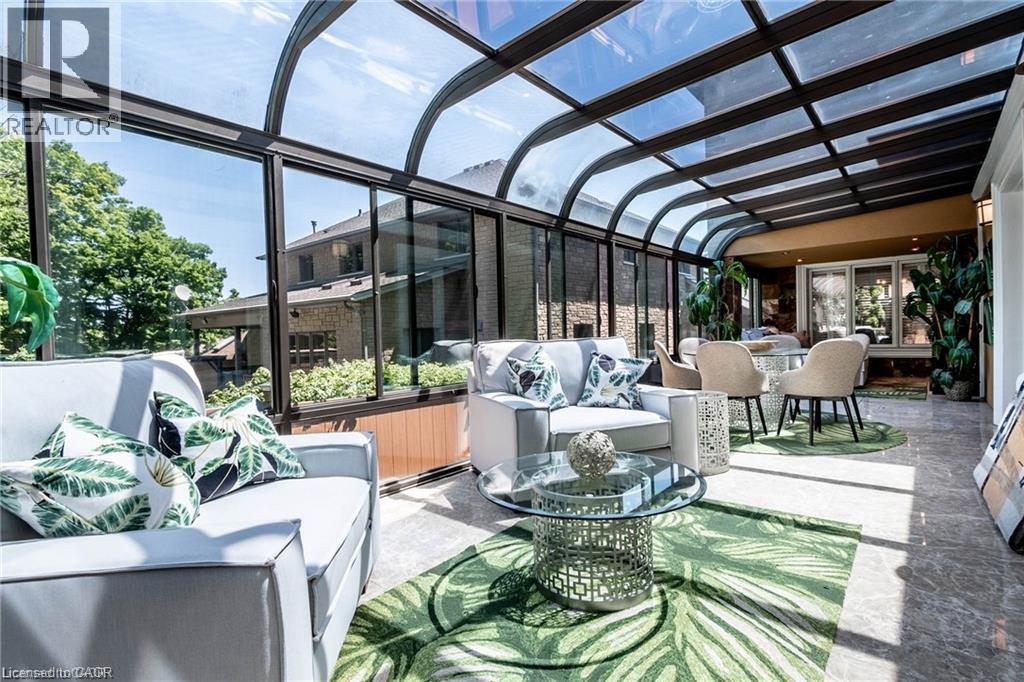 Curved glass ceiling and wall panels provide abundant natural light - 76 Adriatic Boulevard, Hamilton, ON - Outdoor With Deck Patio Veranda