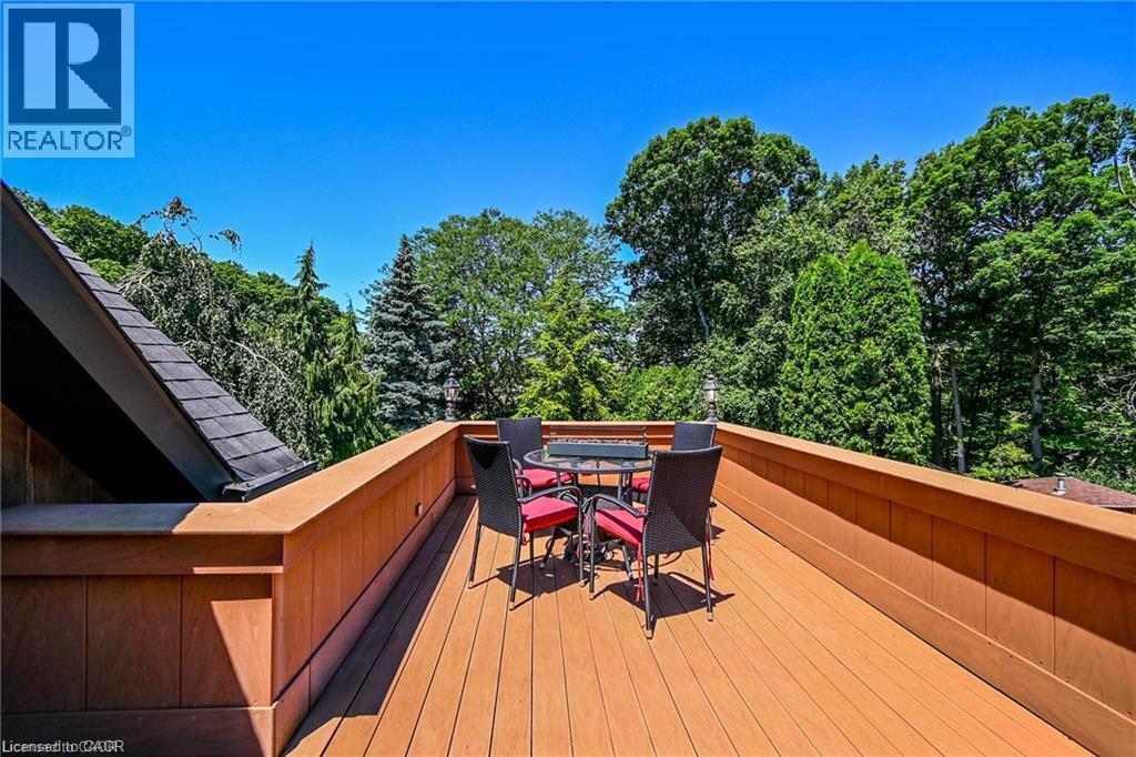 Expansive outdoor deck featuring composite decking and a perimeter privacy wall - 76 Adriatic Boulevard, Hamilton, ON - Outdoor