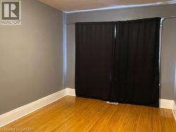 Hardwood flooring complemented by crisp white baseboards -