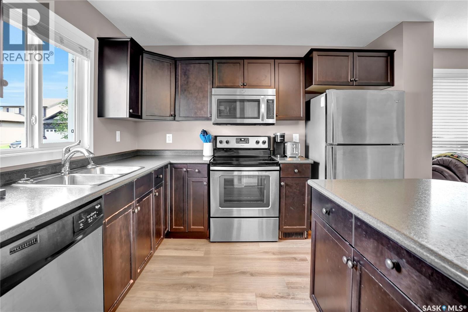 68 4850 Harbour Landing Drive, Regina, SK - Indoor Photo Showing Kitchen With Double Sink