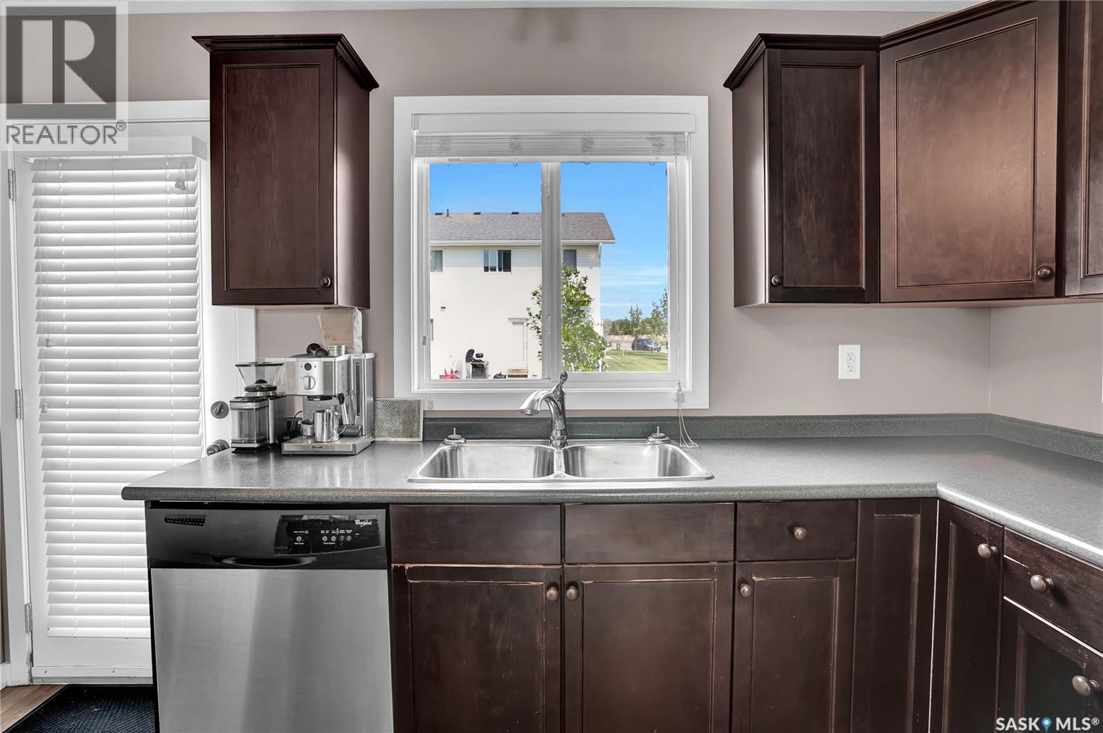 68 4850 Harbour Landing Drive, Regina, SK - Indoor Photo Showing Kitchen With Double Sink