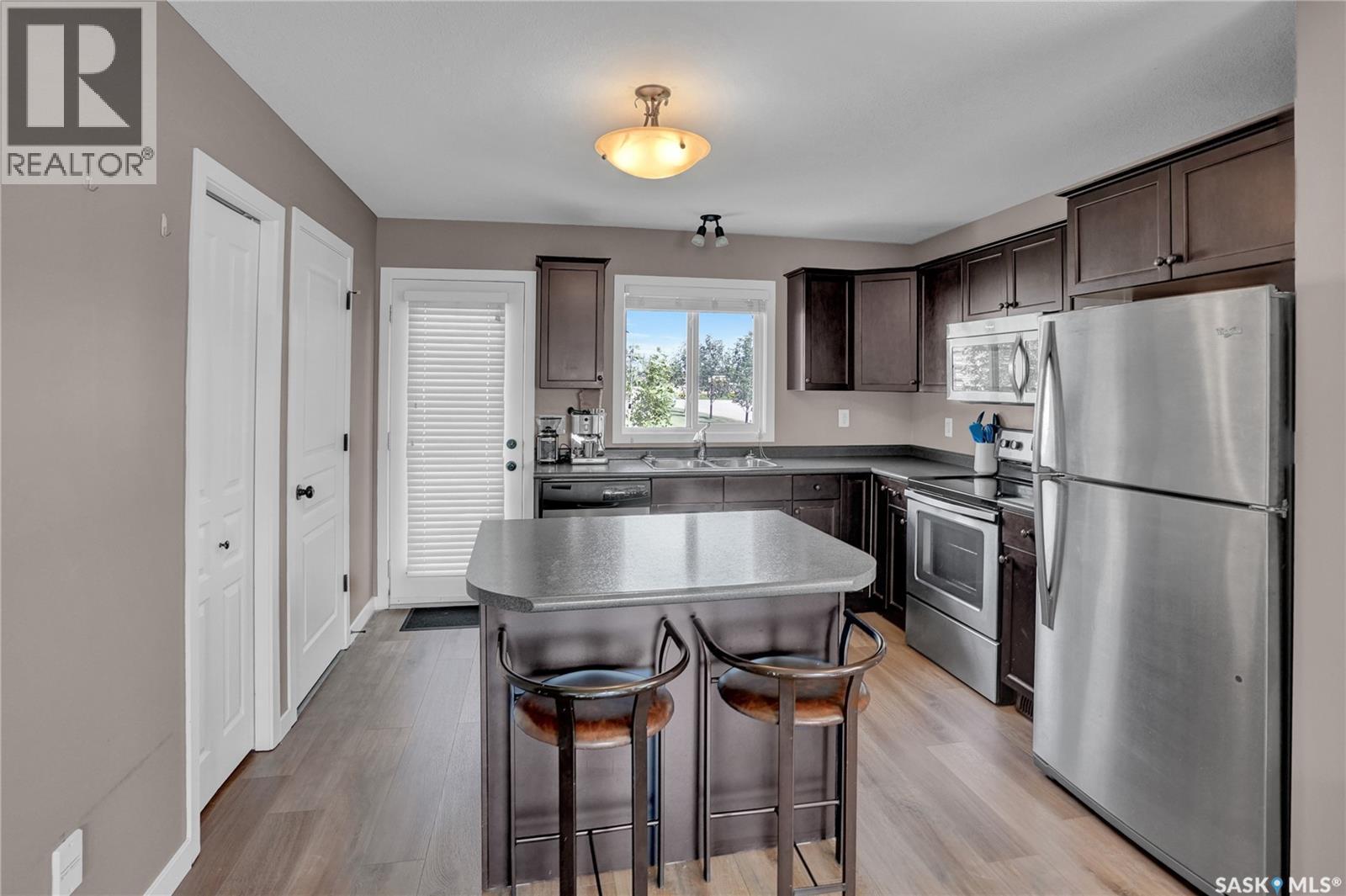 68 4850 Harbour Landing Drive, Regina, SK - Indoor Photo Showing Kitchen With Double Sink
