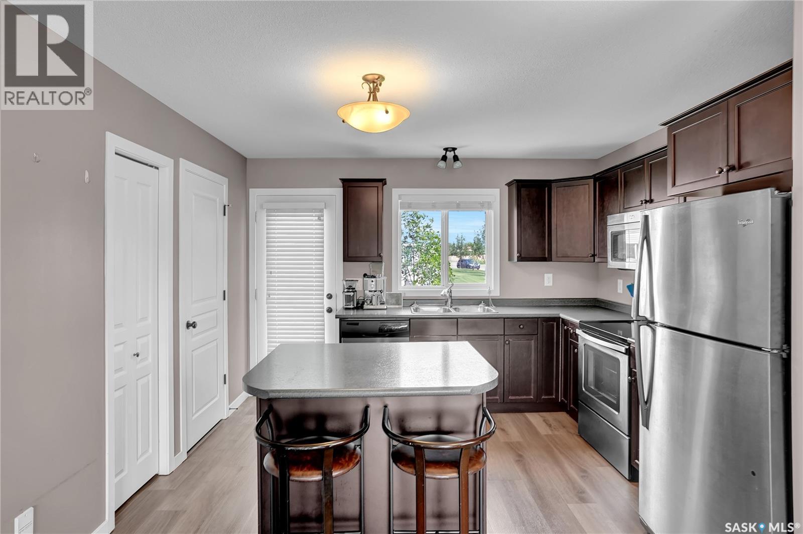 68 4850 Harbour Landing Drive, Regina, SK - Indoor Photo Showing Kitchen With Double Sink