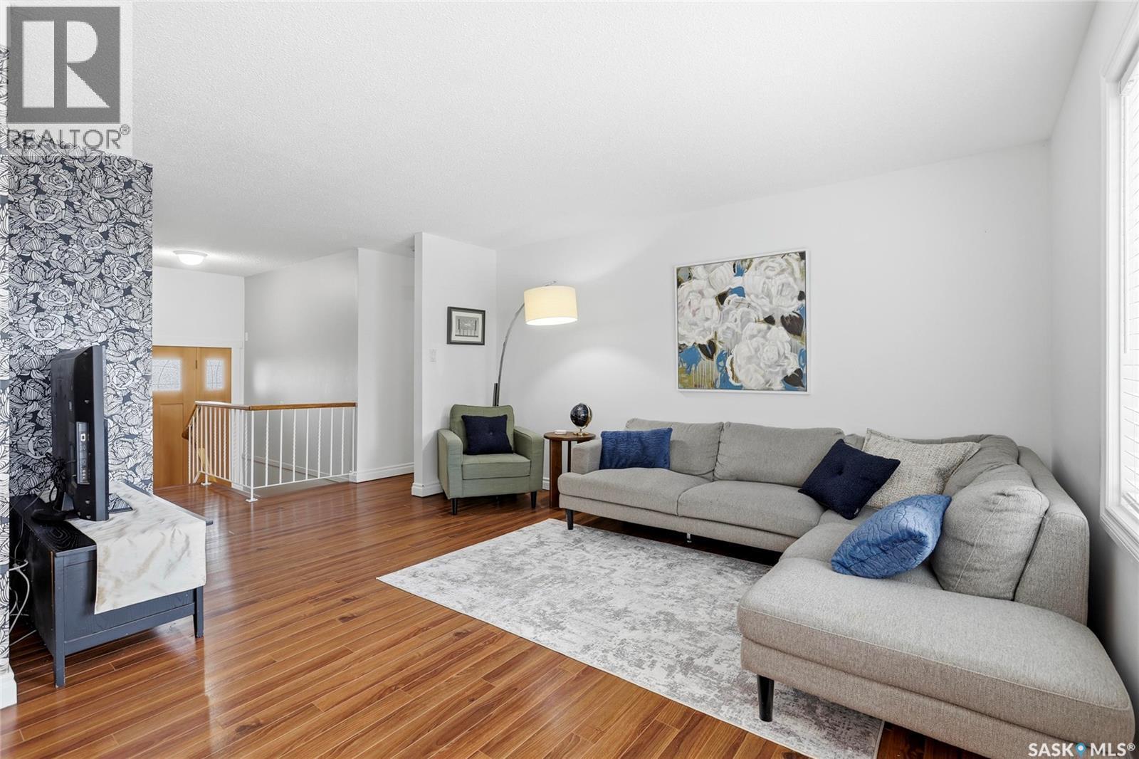 80 Cameron Crescent, Regina, SK - Indoor Photo Showing Living Room With Fireplace
