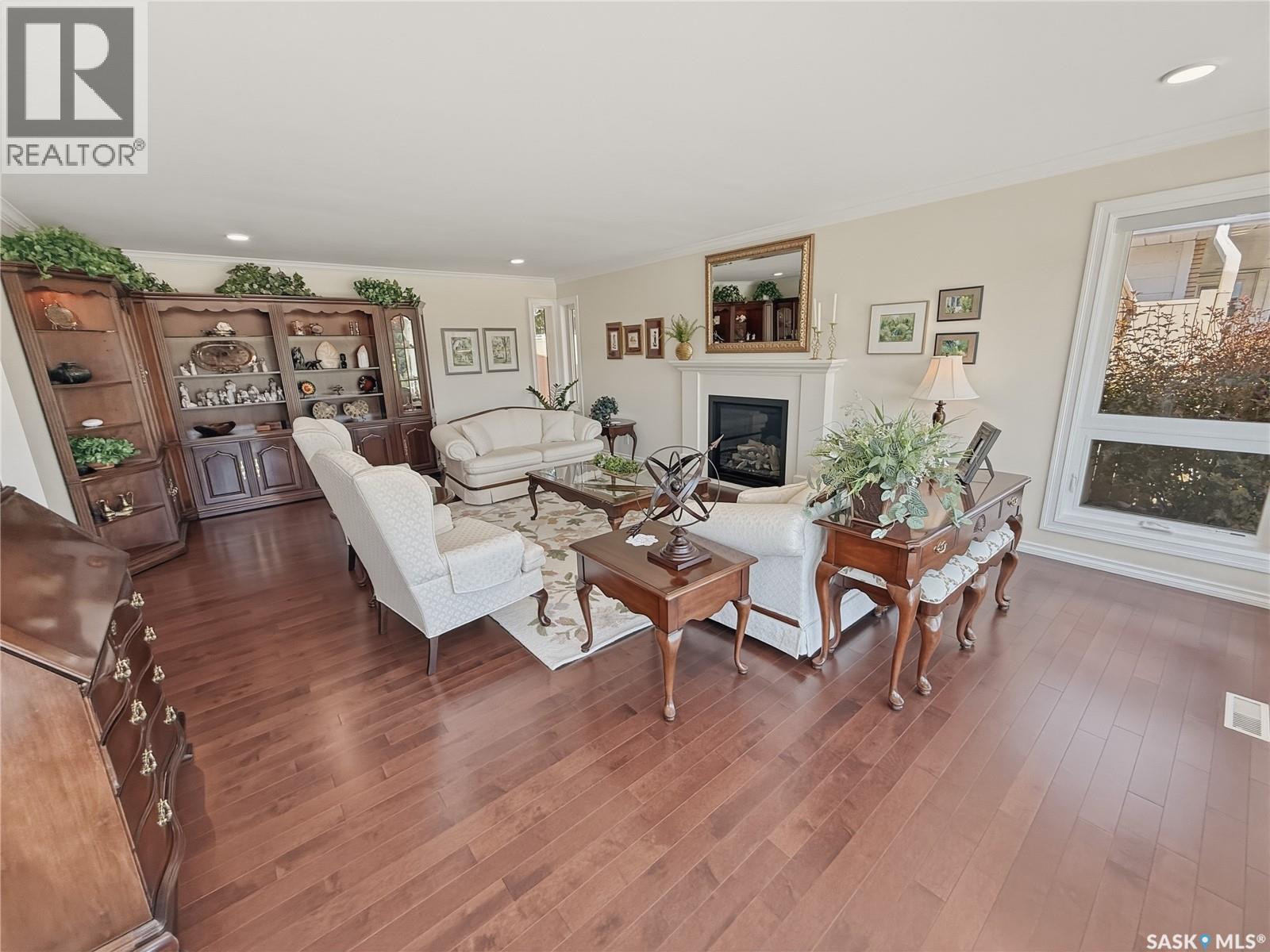 1165 North Hill Drive, Swift Current, SK - Indoor Photo Showing Living Room With Fireplace
