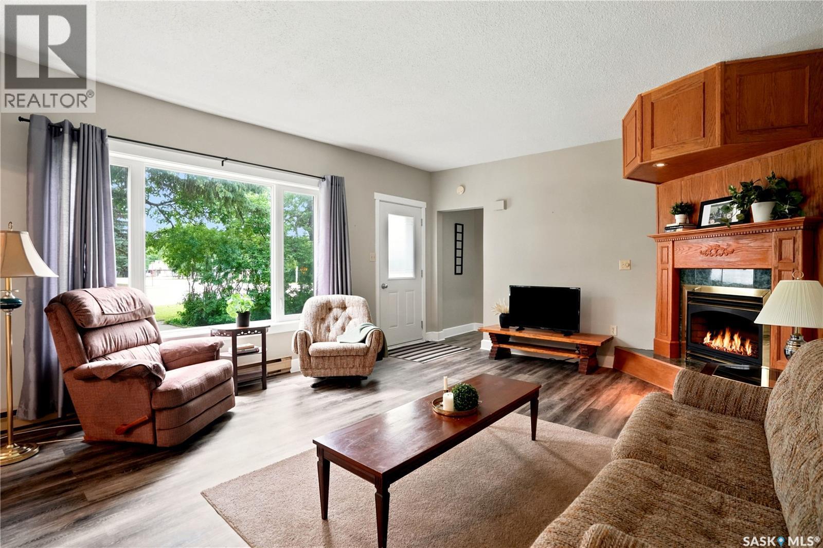300 Main Street, Dysart, SK - Indoor Photo Showing Living Room With Fireplace