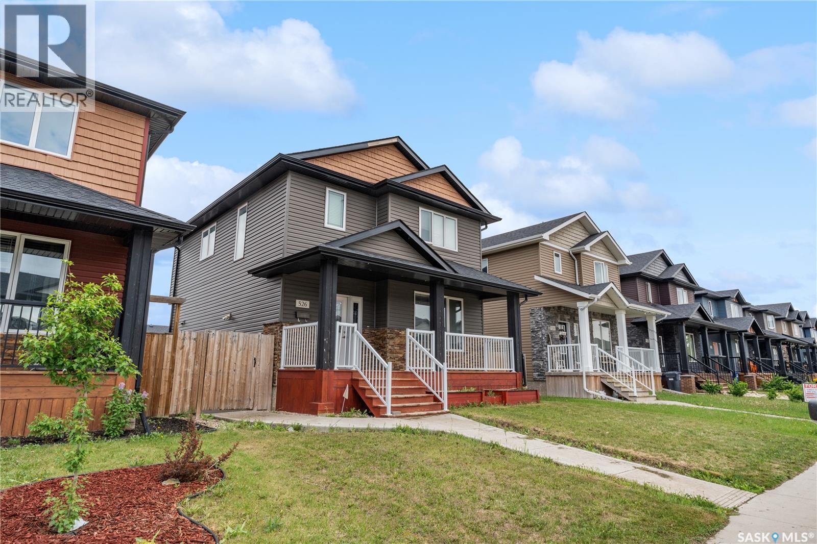 526 Maple Crescent, Warman, SK - Outdoor With Deck Patio Veranda With Facade