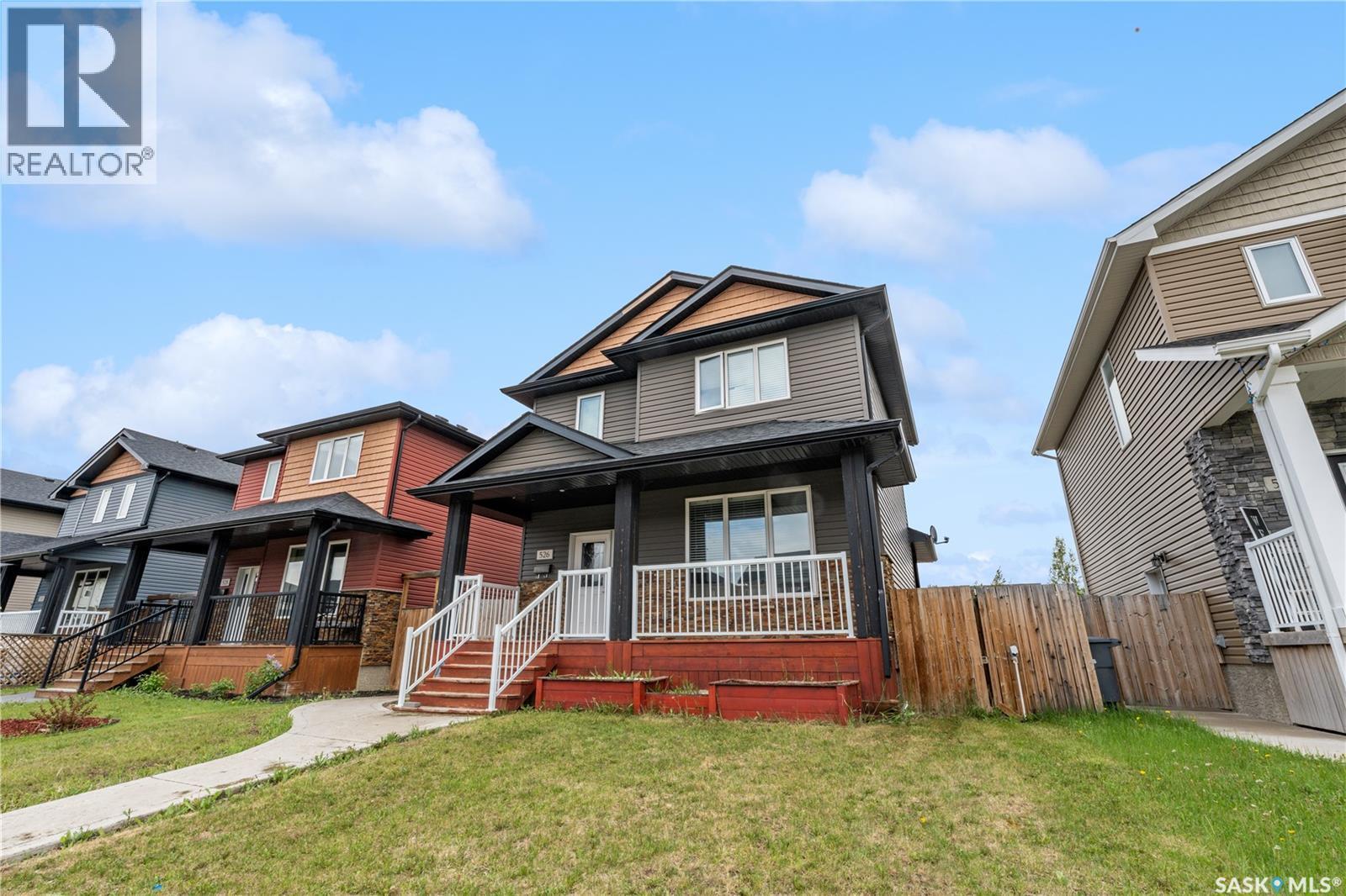 526 Maple Crescent, Warman, SK - Outdoor With Deck Patio Veranda With Facade