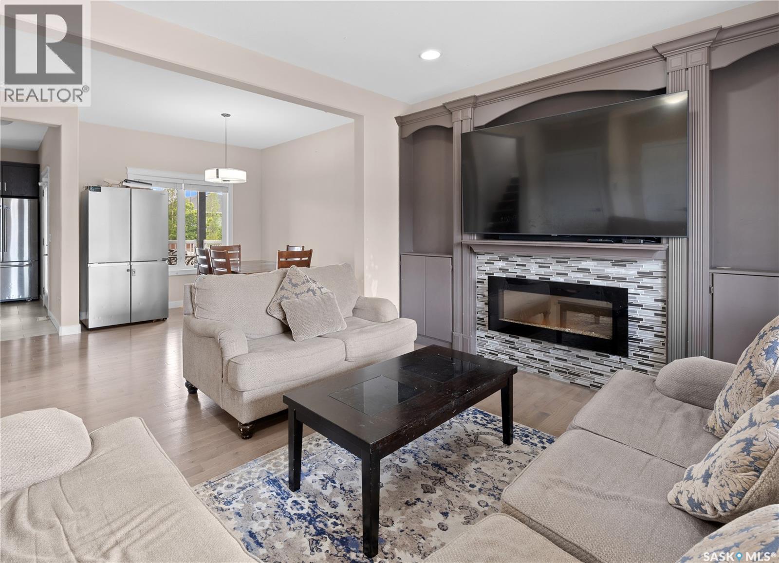 526 Maple Crescent, Warman, SK - Indoor Photo Showing Living Room With Fireplace